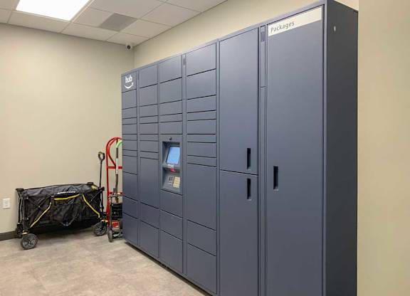 a room with amazon branded electronic package lockers