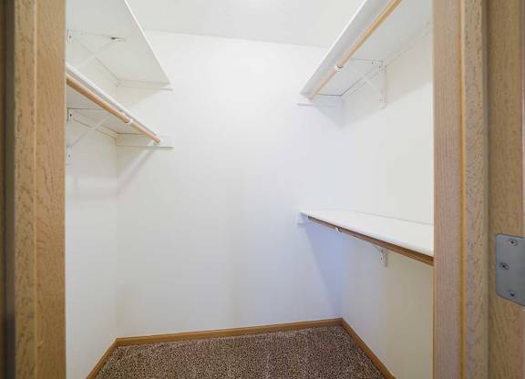a walk in closet in the primary bedroom of the Ponderosa duplex