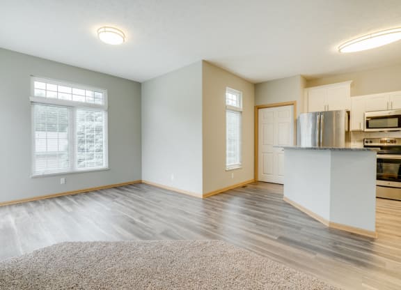 Open floor plan with kitchen and living room at Cascade Pines Duplex and townhomes