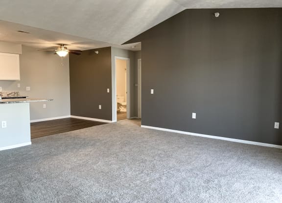 Spacious living room and dining room in the renovated style at Eagle Run Apartments in Omaha Nebraska