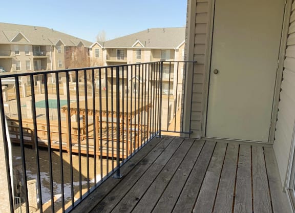 balcony overlooking community swimming pool at Eagle Run Apartments in Omaha Nebraska