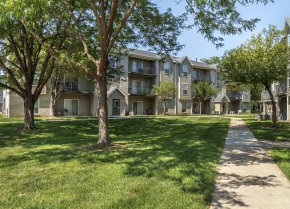 Walkway with greenspace to Eagle Run Apartments in northwest Omaha 68164