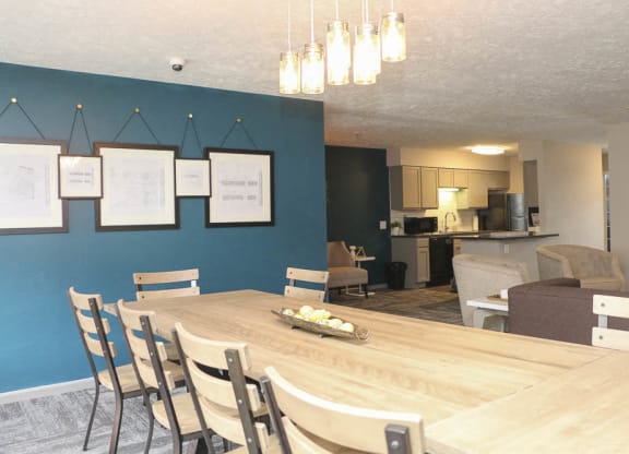 Large table in the clubhouse at Eagle Run Apartments in Omaha NE