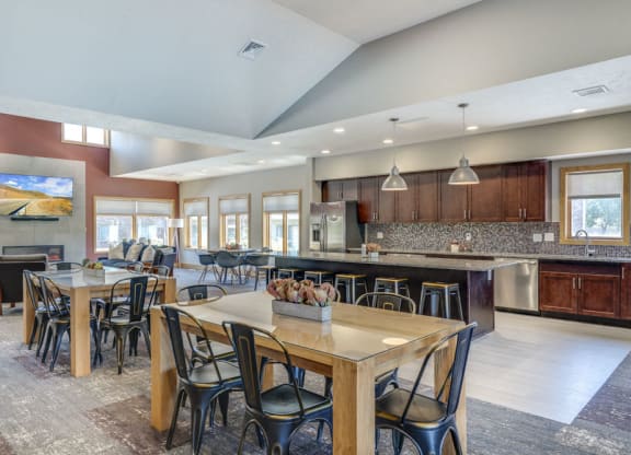 Clubhouse with seating and kitchen for resident's use at Fountain Glen Apartments