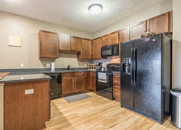Interiors- Hardwood-like flooring in the kitchen at the Villas of Omaha Butler Ridge in Omaha NE
