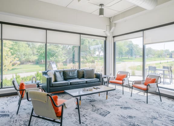 the preserve at ballantyne commons living room with furniture and large windows