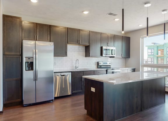 Beautiful kitchen island which provides plenty of extra storage with the additional cabinet space provided at Haven at Uptown in Lincoln, NE