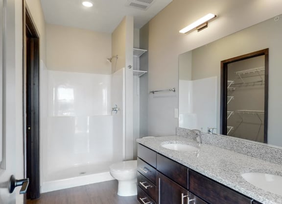 Large master bathroom with dual sink counters at Haven at Uptown in Lincoln, NE