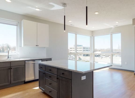 Open concept kitchen and living-dining space in the Shine floor plan at Haven at Uptown in Lincoln, NE