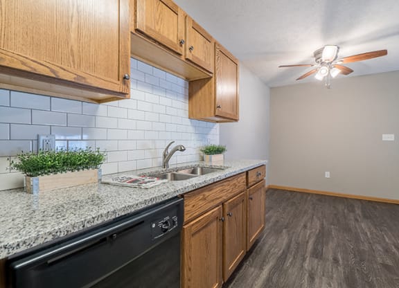 bright kitchen with granite countertop at Williamsburg Park Apartments in Lincoln NE