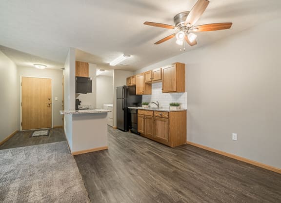 Kitchen with hardwood-style flooring at Williamsburg Park Apartments in Lincoln NE