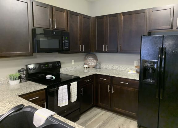 Spacious kitchen with granite counters and lots of storage space at North Pointe Villas