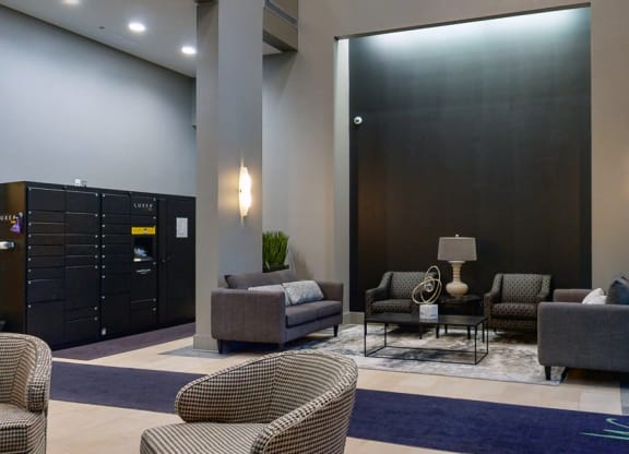 Sit back and relax in the modern lobby at Midtown Crossing Apartments in Omaha.