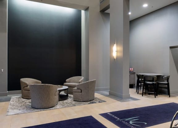 Grab a book and relax in the modern lobby at Midtown Crossing Apartments in Omaha.