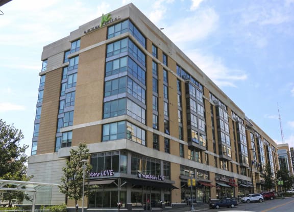 Multi-story apartment building with businesses on the street level