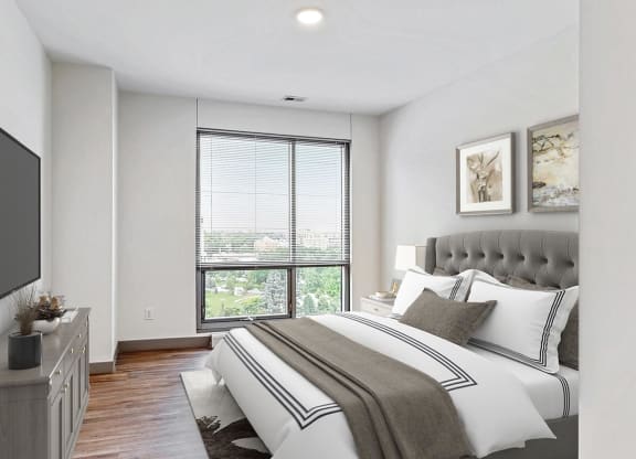 Spacious bedroom with floor-to-ceiling windows a 2 bedroom penthouse floor plan Midtown Crossing Apartments Omaha