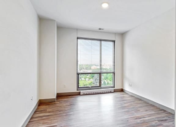 Spacious bedroom with floor-to-ceiling windows a 2 bedroom penthouse floor plan Midtown Crossing Apartments Omaha