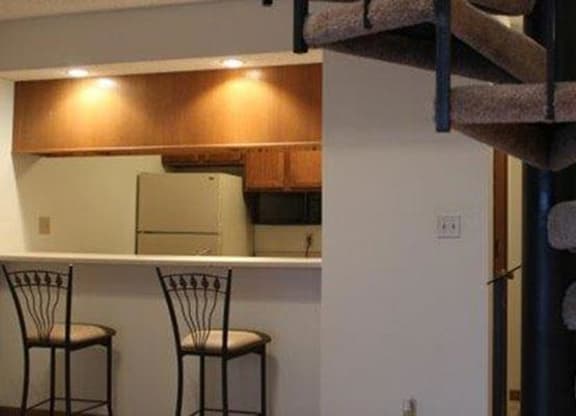 kitchen bar seating and stair case at Packard House Apartments in Lincoln Nebraska
