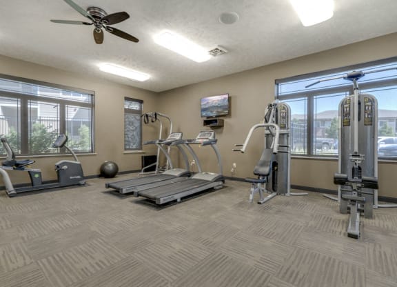 Fitness center with strength and cardio equipment at North Pointe Villas