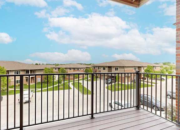 A view from the balcony overlooking the community and blue sky.