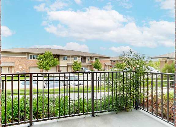 A view from the balcony of the neighboring homes, and the green spaces in the community.