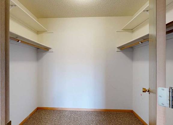 large walk in closet with shelving