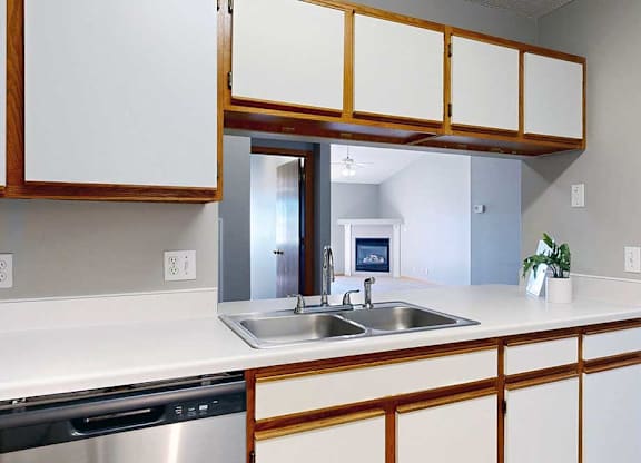 kitchen with a white countertop and white cabinets.