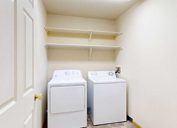 washing machine and dryer in a laundry room
