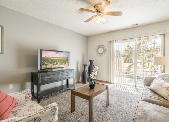 Bright living room with walkout patio and natural lighting
