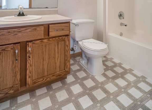 an empty bathroom with a toilet and a sink