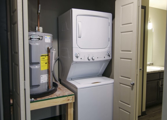 Stacked washer and dryer off bathroom at Northridge Heights in Lincoln