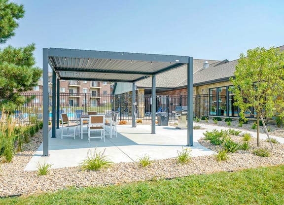Covered outdoor seating and dining area with modern furniture
