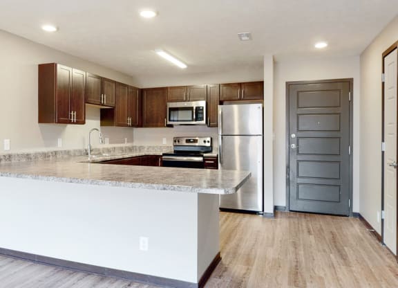 Renovated kitchen with large peninsula island with ample storage at Northridge Heights