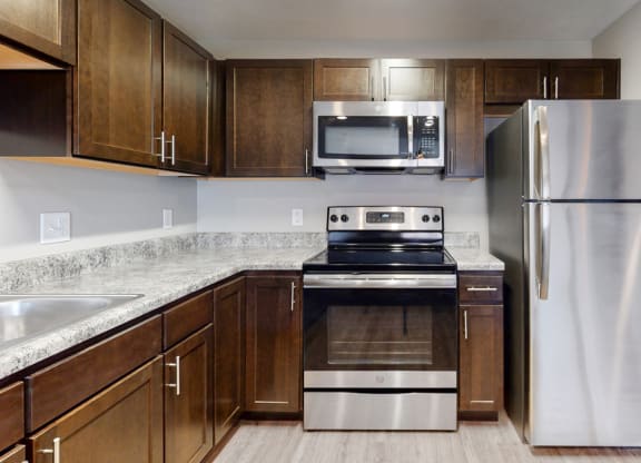 Renovated kitchen with granite and many cabinets for lots of storage