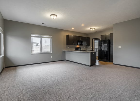 Interiors- Large living space with abundant natural light at the Villas of Omaha at Butler Ridge in Omaha Nebraska