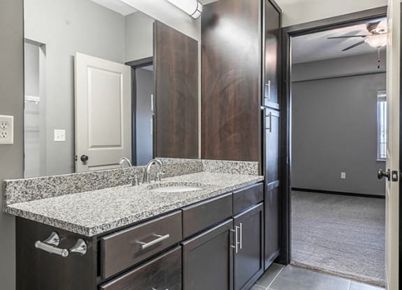 Interiors- Granite countertops vanity in Bathroom at the Villas of Omaha at Butler Ridge in Omaha Nebraska