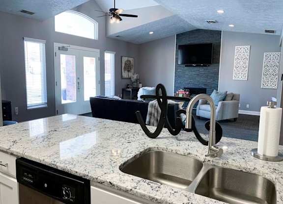 a kitchen with a sink and a counter top