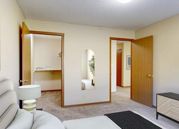 bedroom with queen size bed and walk in closet