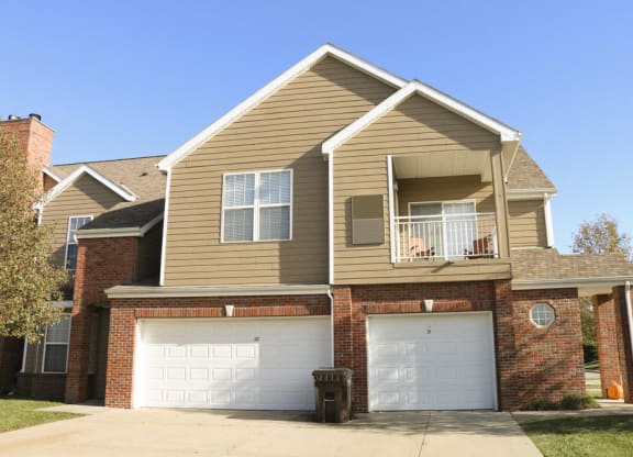 Exteriors-View of Ridge Pointe Villas townhomes with attached 1 and 2 car garages