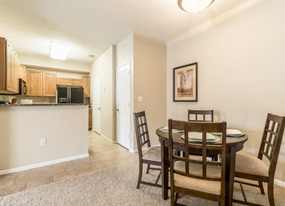 Interiors-Dining room with kitchen view at Ridge Pointe Villas