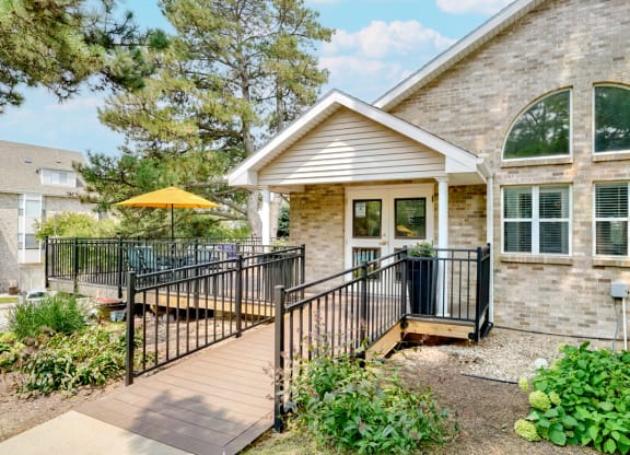 Exterior of the Skyline View clubhouse and leasing office with wraparound porch