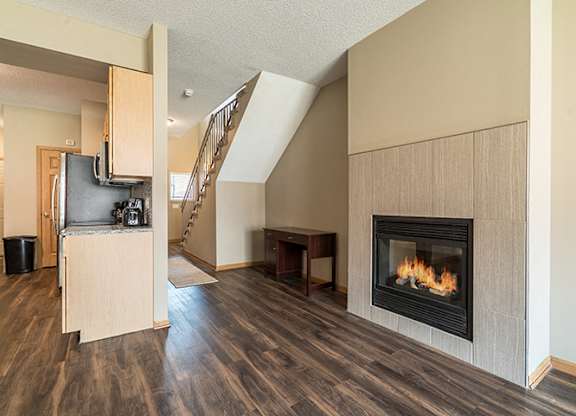 Cozy fireplace and hardwood-style flooring at Southwind Villas in La Vista NE