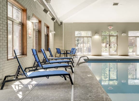 Lounge chairs next to indoor swimming pool at Southwind Villas in southwest Omaha in La Vista, NE, 68128