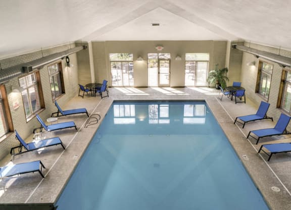 Indoor swimming pool with poolside chairs at Southwind Villas in southwest Omaha in La Vista, NE, 68128