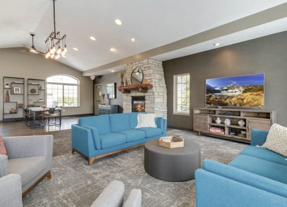 Clubhouse with TV lounge and tables for residents at Stone Creek Villas townhomes in west Omaha NE 68116