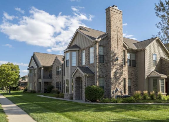 Exterior view of private entrances and large windows at Stone Creek Villas townhomes in west Omaha NE 68116