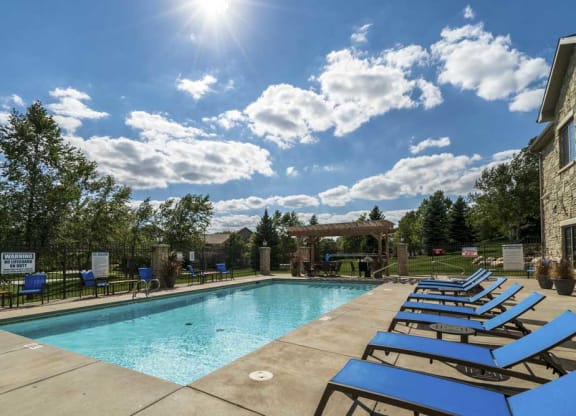 View of swimming pool and pergola at Stone Creek Villas townhomes in west Omaha NE 68116