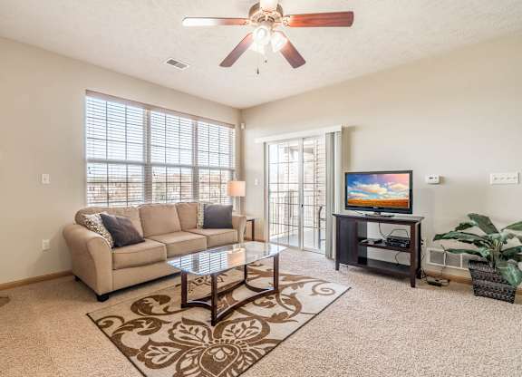 a living room with a couch and a tv