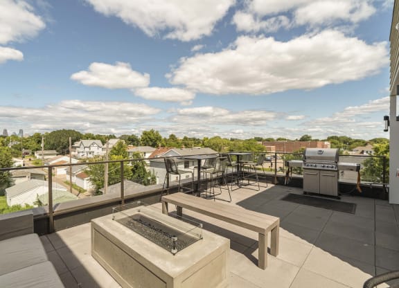 Rooftop patio and outdoor firepit at The Central apartments near downtown Minneapolis MN 55408