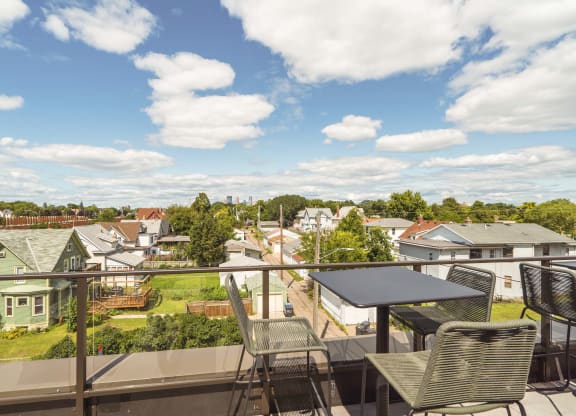 Scenic views from the rooftop patio and outdoor firepit at The Central apartments near downtown Minneapolis MN 55408